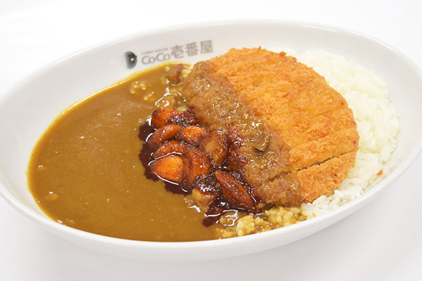 旨辛にんにく<br>※写真はロースカツカレー(1040円）にトッピングしたものです。すべてのカレーメニューにトッピングできます。